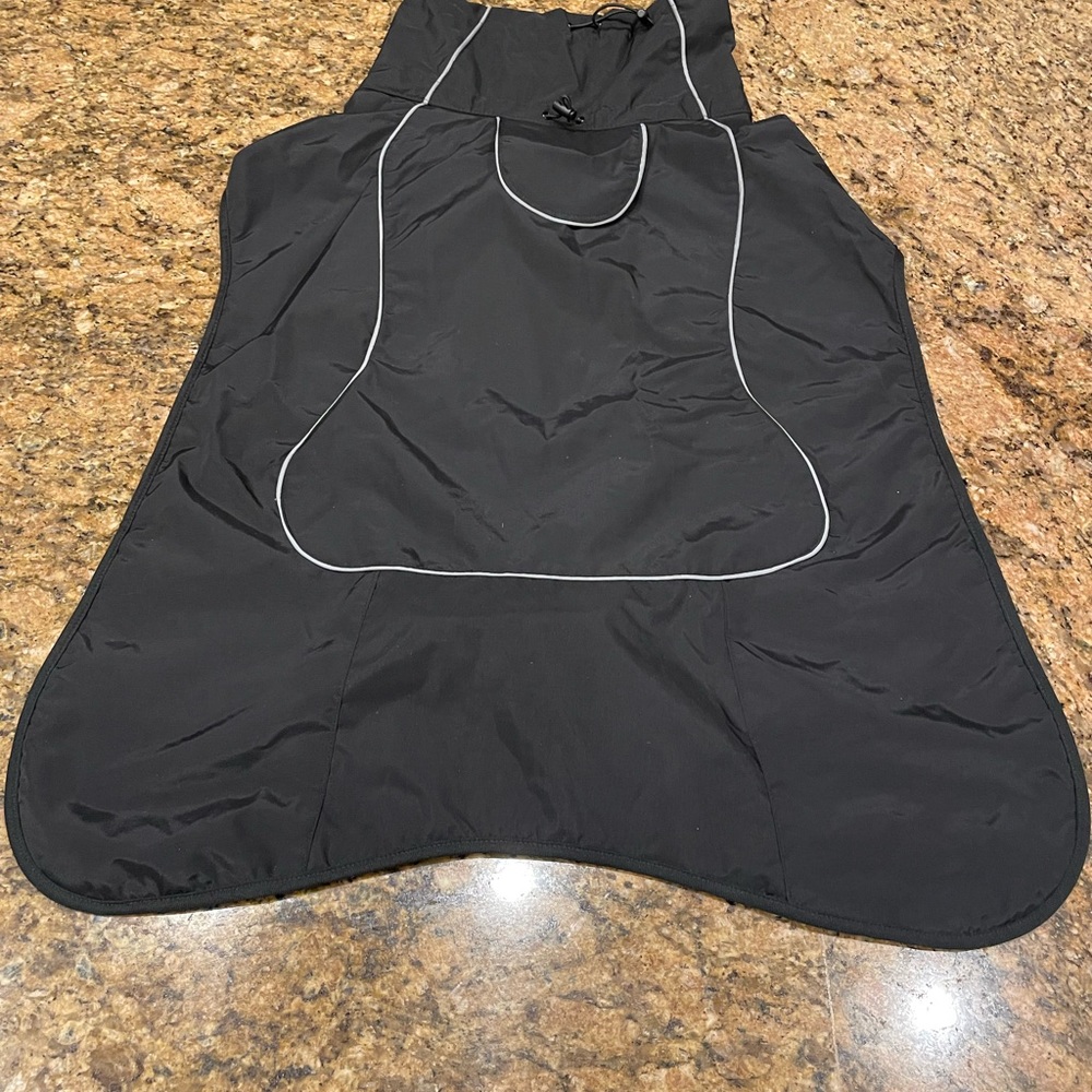 Brand new dog jacket with reflective trim! Fleece lined, water repellent !
